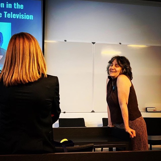 Chatting with conference attendees before my talk at the Screenwriting Research Conference in Porto, Portugal